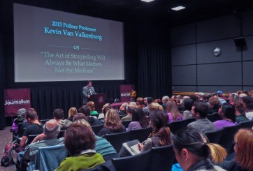 Kevin Van Valkenburg speaks to a crowded theater