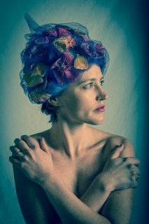 photo of woman wearing multi-colored cap