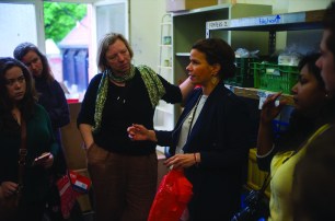 Montana Journalism students are shown around the headquarters of Moabit Hilft, where a team provides clothing, food, and basic amenities to refugees as they wait for their asylum claims to be processed.