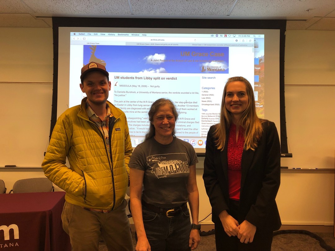 Three people in front of room