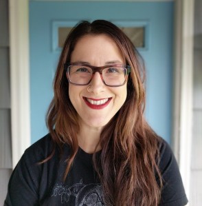 Woman wearing glasses looking at camera. Leah Sottile